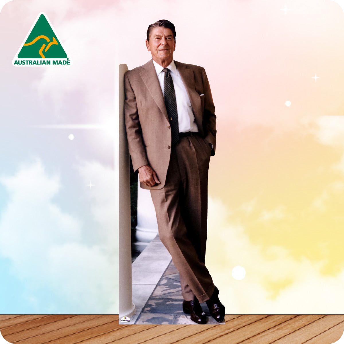 Man in a suit standing on a wooden floor with 'Australian Made' logo in the corner.