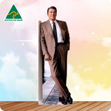 Man in a suit standing on a wooden floor with 'Australian Made' logo in the corner.