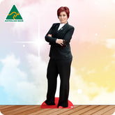 Life-size Sharon Osbourne cutout wearing a black fitted dress and red heels
