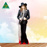 Life-size Steven Tyler cutout wearing a patterned jacket, graphic shirt, black trousers, boots and layered scarves.
