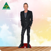 Life-size Sting cutout wearing a black T-shirt, dark jeans, black boots and a leather wristband.