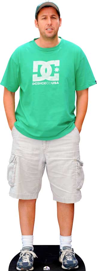 Man wearing a green t-shirt and gray shorts standing on a black platform.