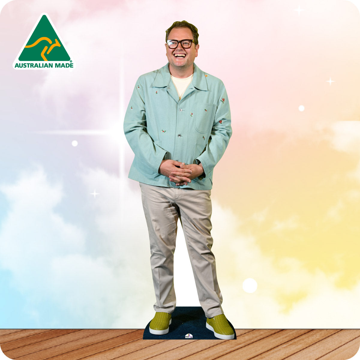 Cardboard cutout of a person wearing a light blue jacket and beige pants on a colorful background with 'Australian Made' logo.