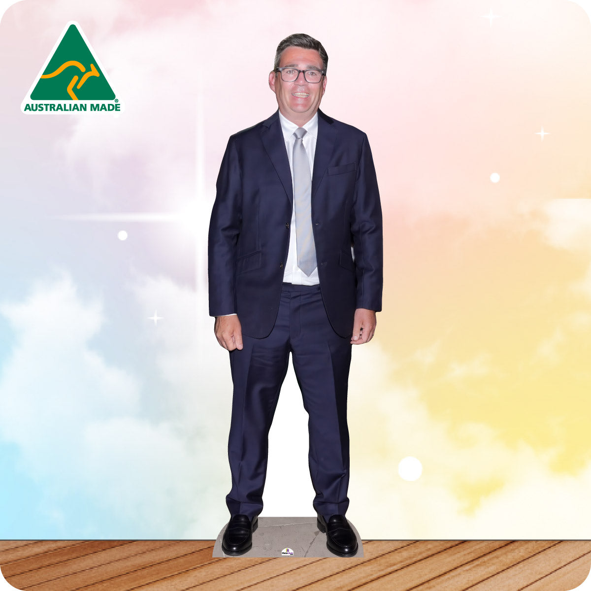 Cardboard cutout of a man in a suit with 'Australian Made' logo on a colorful background