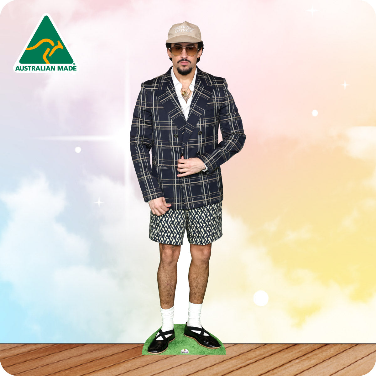 Person wearing a checkered blazer, shorts, and a cap with 'Australian Made' logo in the corner.