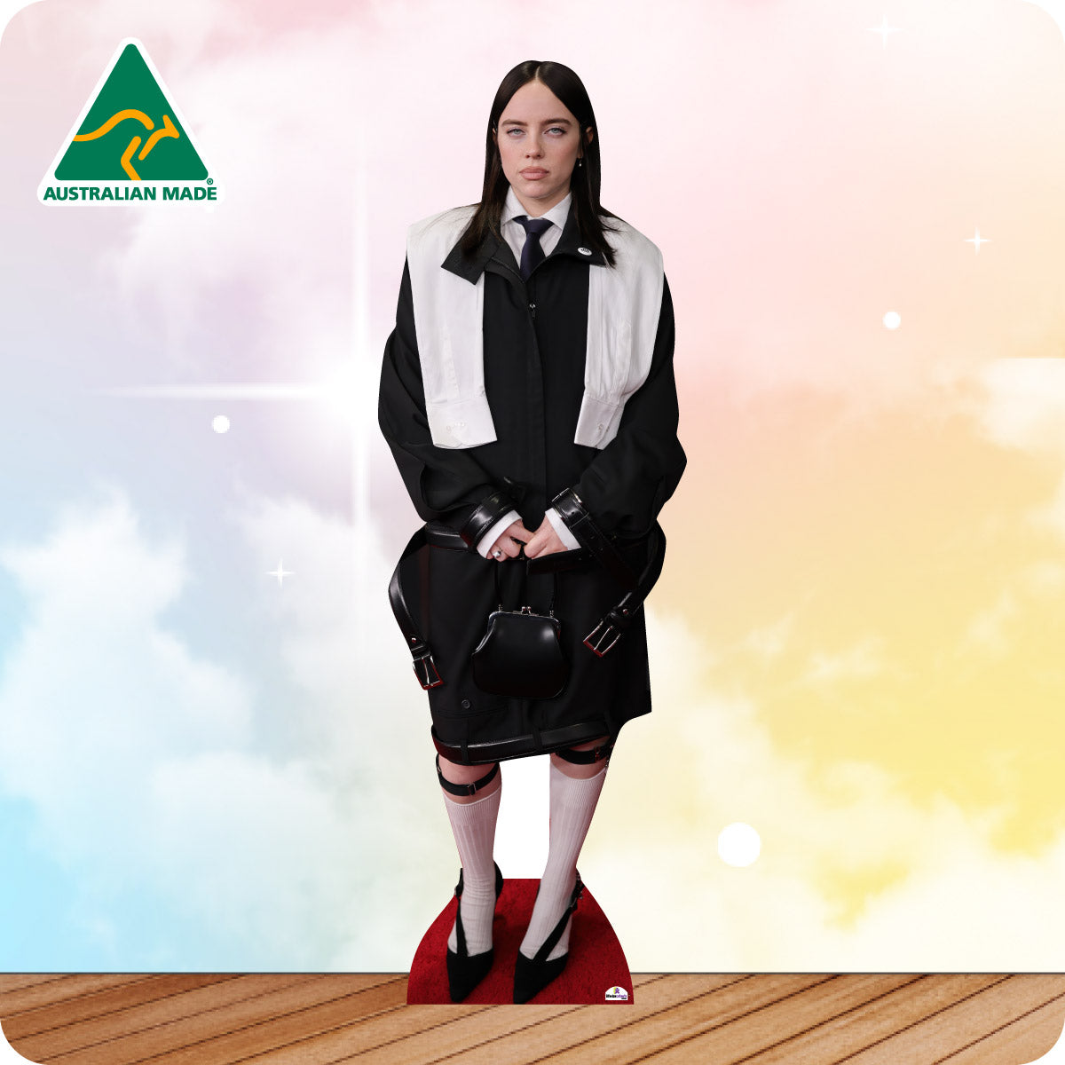 Billie Eilish in a black and white suit