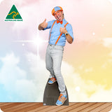 Cardboard cutout of a person in a costume with 'Australian Made' logo on a colorful background