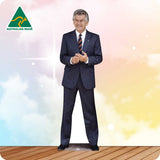 Man in a suit standing on a wooden floor with a colorful background and Australian Made logo.