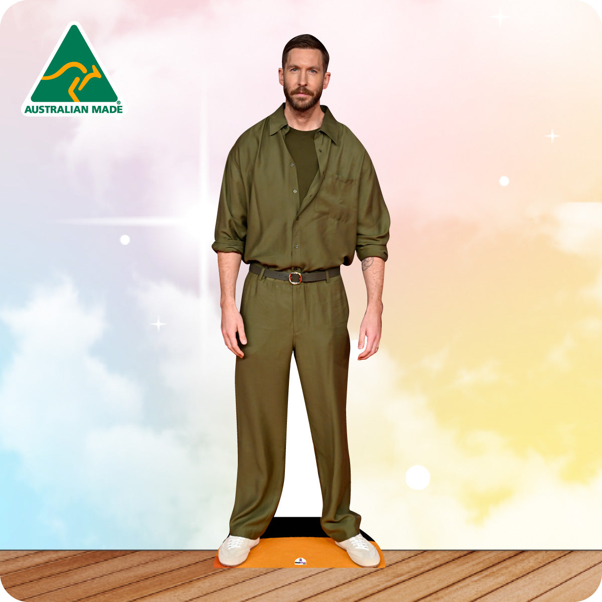 Calvin Harris in a green suit outfit