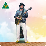 Cardboard standee of a man playing guitar with 'Australian Made' logo on a colorful background.