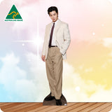 Man wearing a beige suit with a colorful gradient background and 'Australian Made' logo.