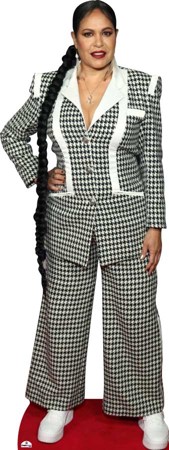 Person wearing a houndstooth patterned suit with white accents on a red platform.