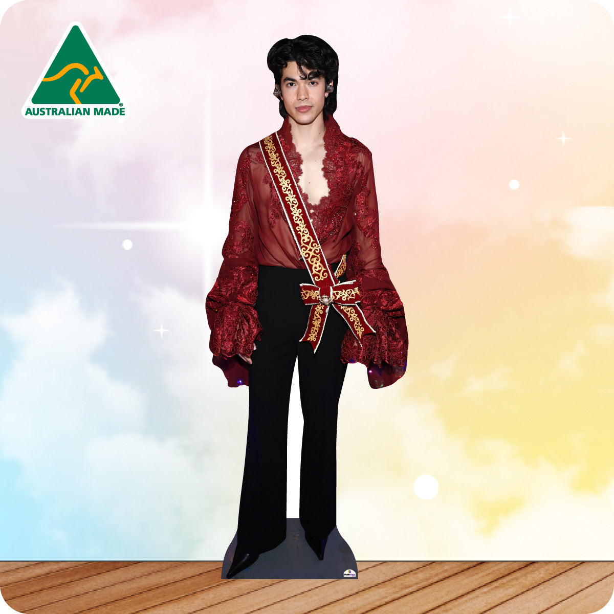 Cardboard cutout of a person in a red outfit with a sash against a colorful gradient background, featuring 'Australian Made' logo.