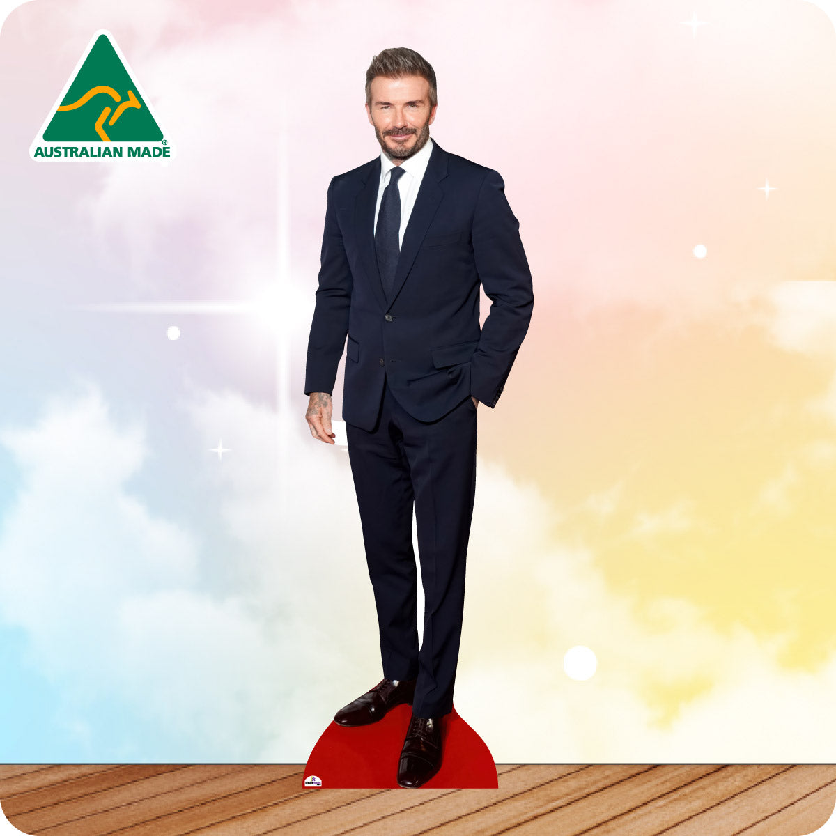 Cardboard cutout of a man in a suit with 'Australian Made' logo on a colorful background