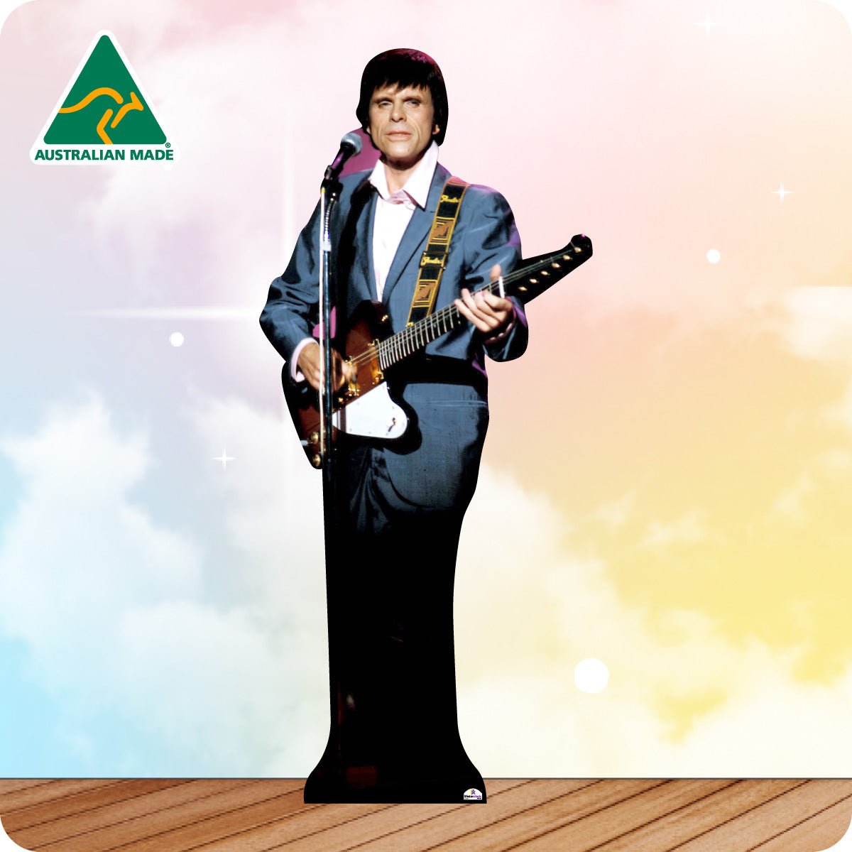 Cardboard cutout of a person in a blue suit playing a guitar with 'Australian Made' logo in the corner.