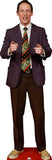 Cardboard cutout of a man in a suit and tie on a white background