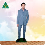 Cardboard cutout of a man in a blue suit with 'Australian Made' logo on a colorful background