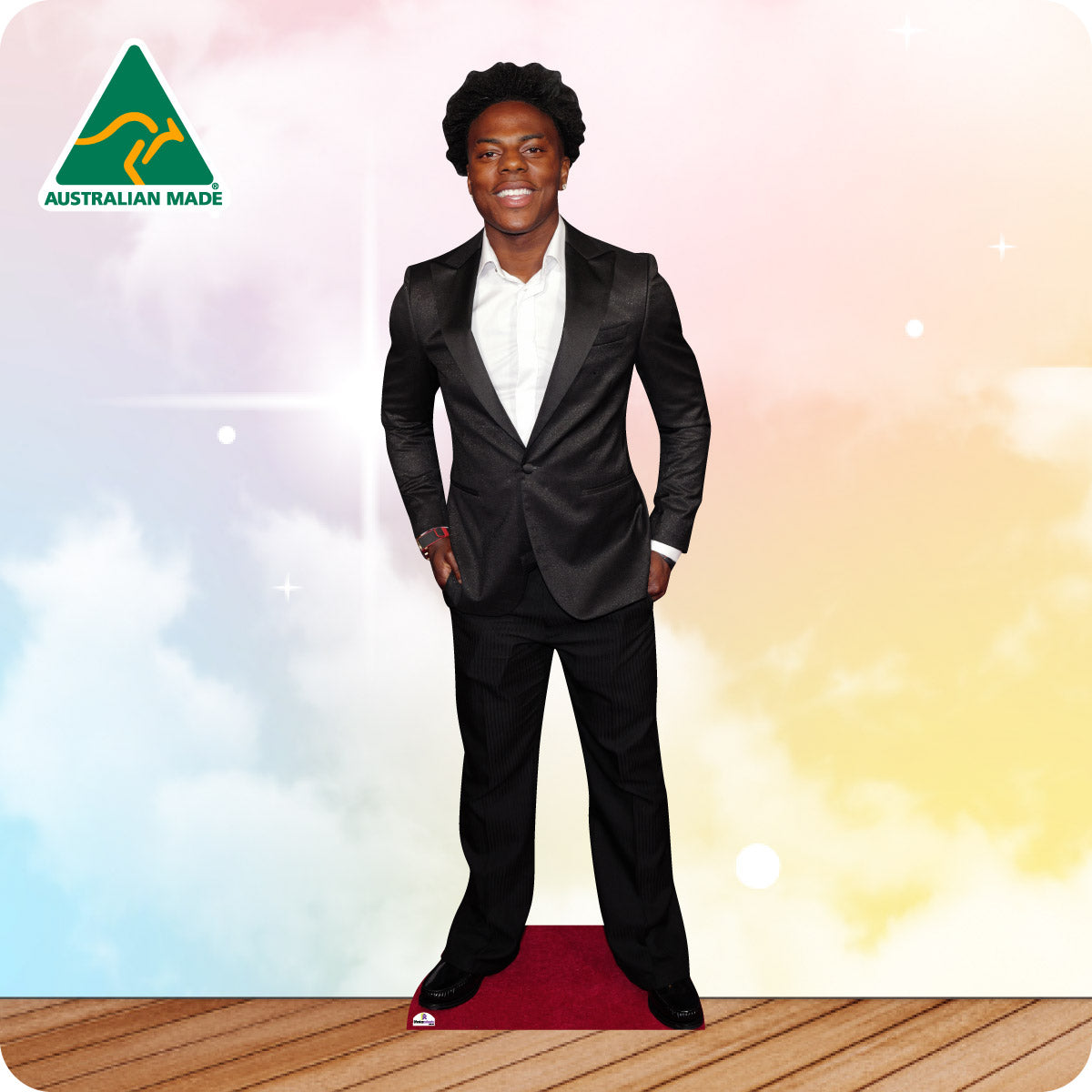 Cardboard cutout of a person in a black suit on a colorful background with 'Australian Made' logo.