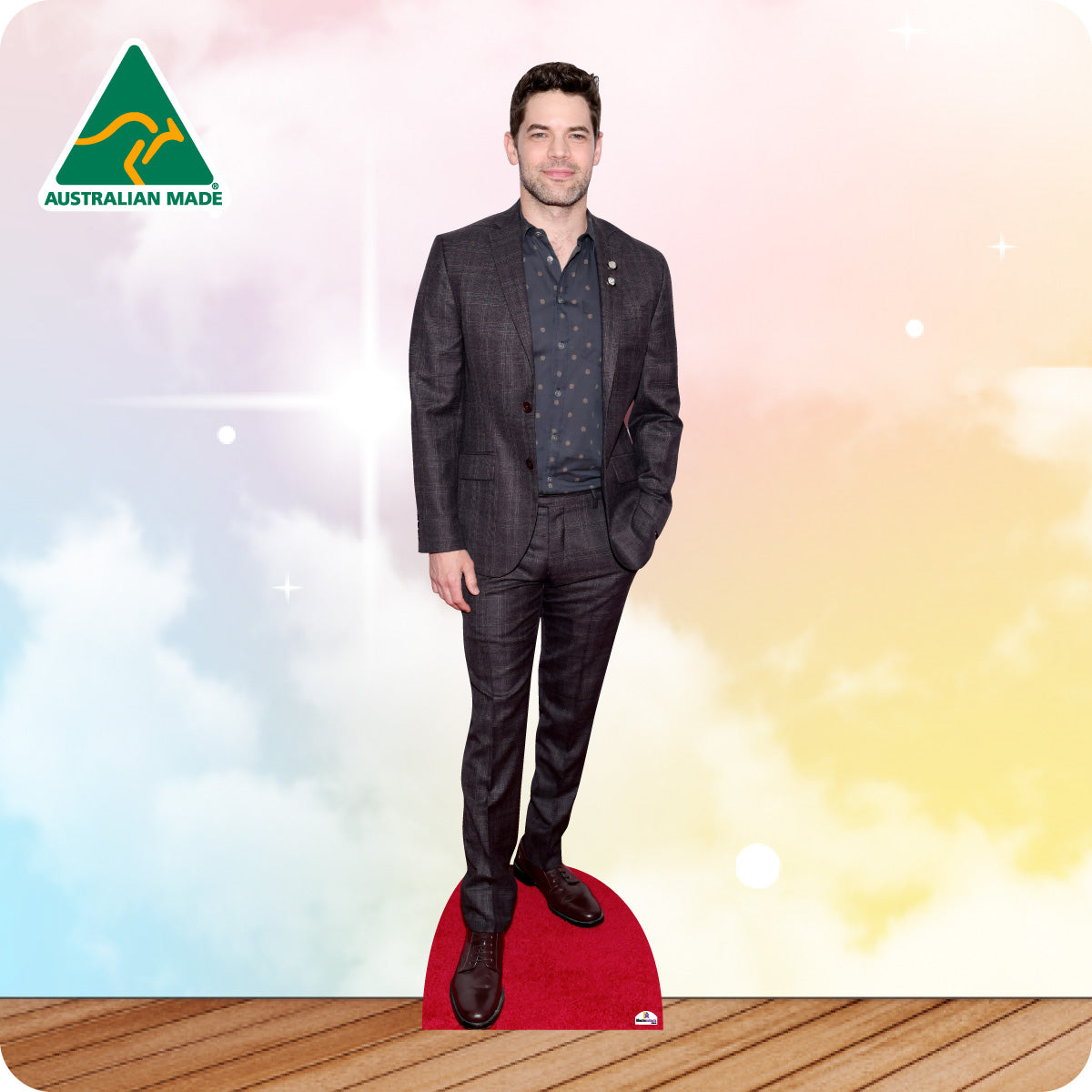 Cardboard cutout of a man in a suit with 'Australian Made' logo on a colorful background