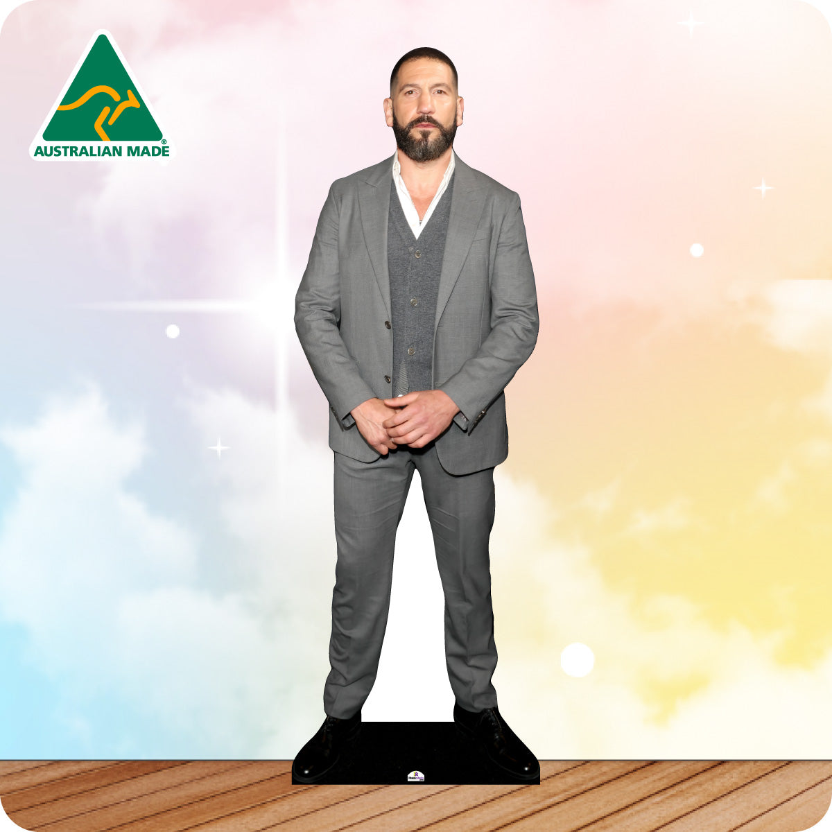 Cardboard standee of a man in a gray suit with 'Australian Made' logo on a gradient background.