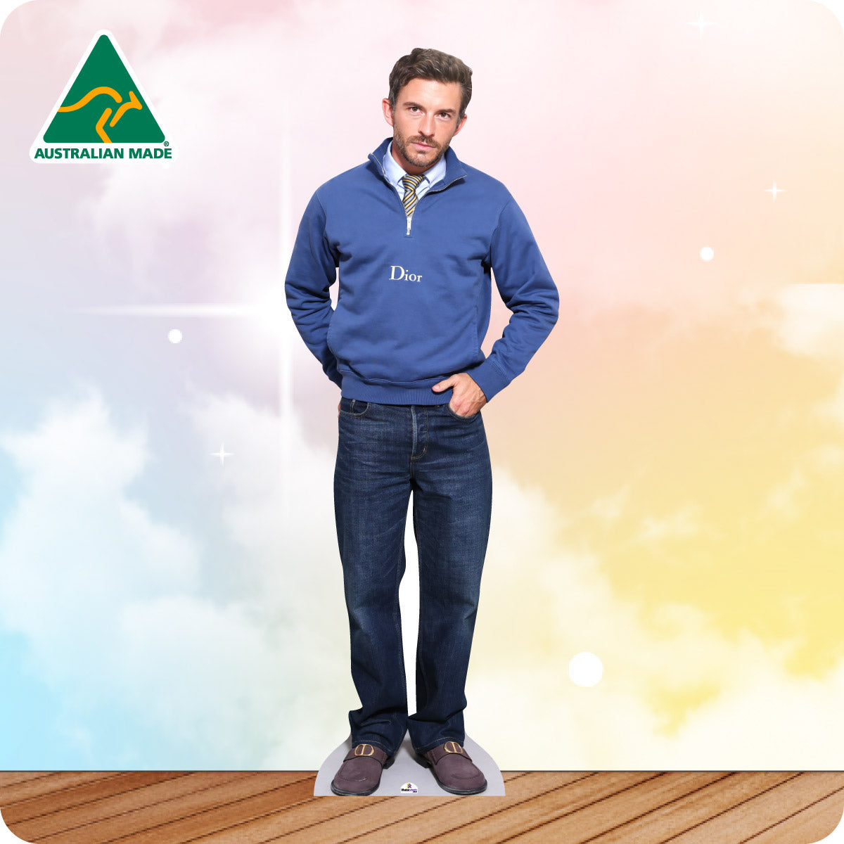 Man wearing a blue sweater with 'Dior' logo and jeans on a colorful background with 'Australian Made' logo.