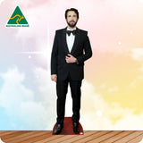 Man in a black suit standing on a red carpet with 'Australian Made' logo in the corner.
