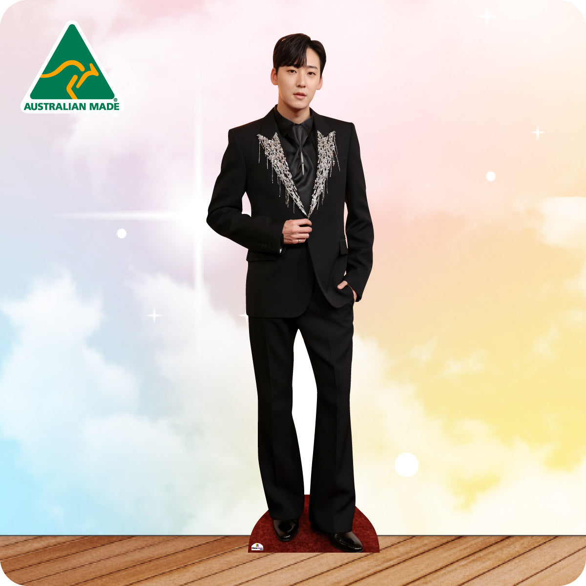 Mannequin wearing a black suit with decorative lapels on a colorful background, Australian Made logo visible.