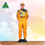 Person wearing an orange racing suit with a blurred background