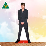 Louis Tomlinson 107 Celebrity Cutout wearing a grey suit on the red carpet.