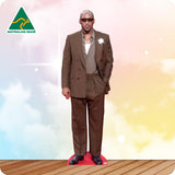 Man in a brown suit standing on a red platform with a colorful background and Australian Made logo.