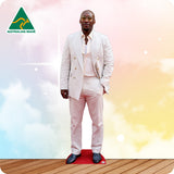 Man in a white suit standing on a red platform with a colorful background and Australian Made logo.