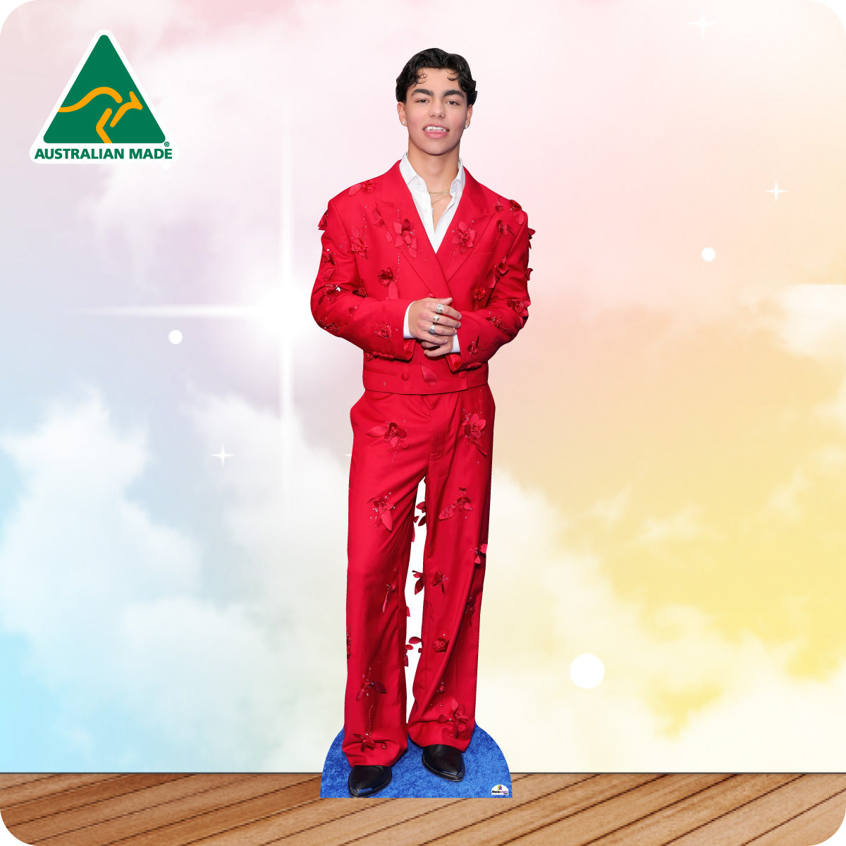 Cardboard cutout of a person in a red outfit with 'Australian Made' logo on a colorful background