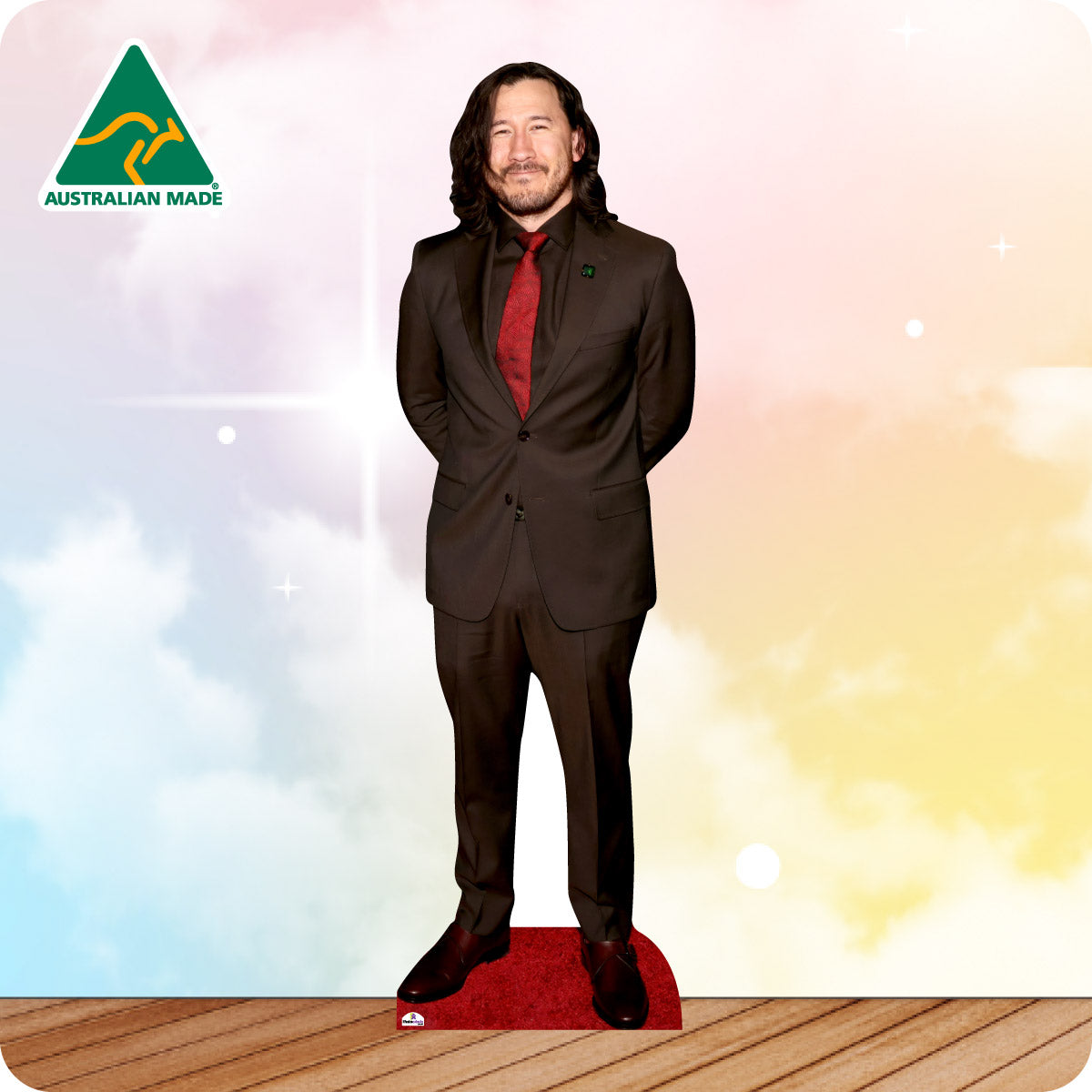 Cardboard cutout of a person in a suit with 'Australian Made' logo on a colorful background