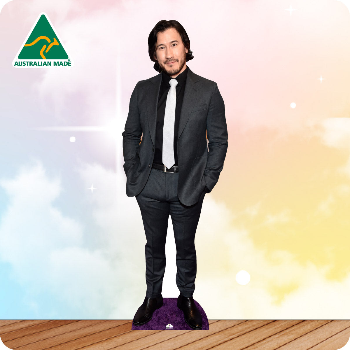 Cardboard cutout of a person in a suit with 'Australian Made' logo on a colorful background