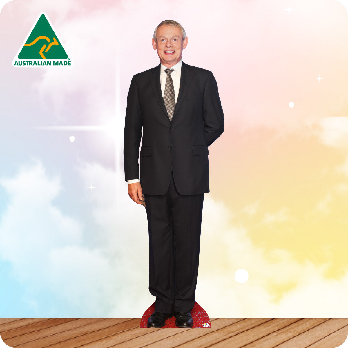 Mannequin wearing a black suit with a tie on a wooden floor and colorful background, featuring 'Australian Made' logo.