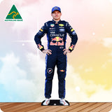 Person wearing a racing suit with sponsor logos on a colorful background