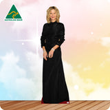 Woman in a black dress standing on a wooden floor with a colorful gradient background, Australian Made logo visible.