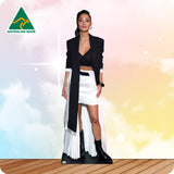 Cardboard standee of a woman in a black and white outfit with 'Australian Made' logo on a colorful background.