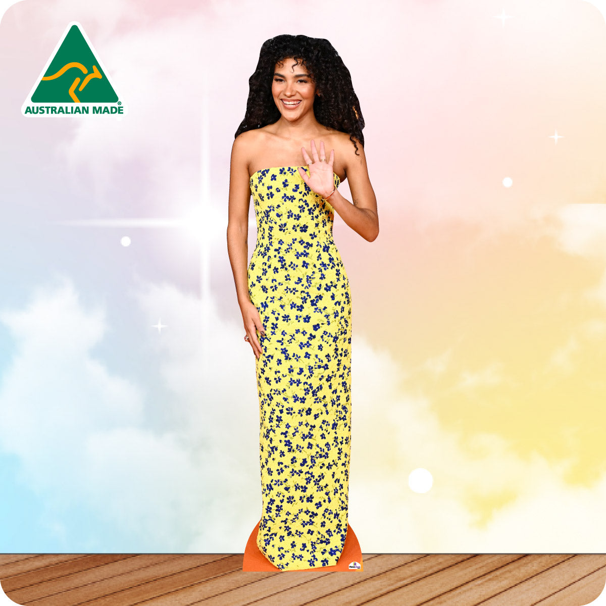 Woman wearing a yellow floral strapless dress with 'Australian Made' logo in the corner.