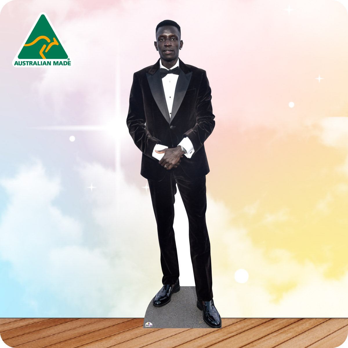 Cardboard cutout of a man in a black tuxedo with 'Australian Made' logo in the corner.