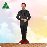 Life-size Phil Jamieson cutout wearing a black leather jacket, black T-shirt, black jeans and boots.