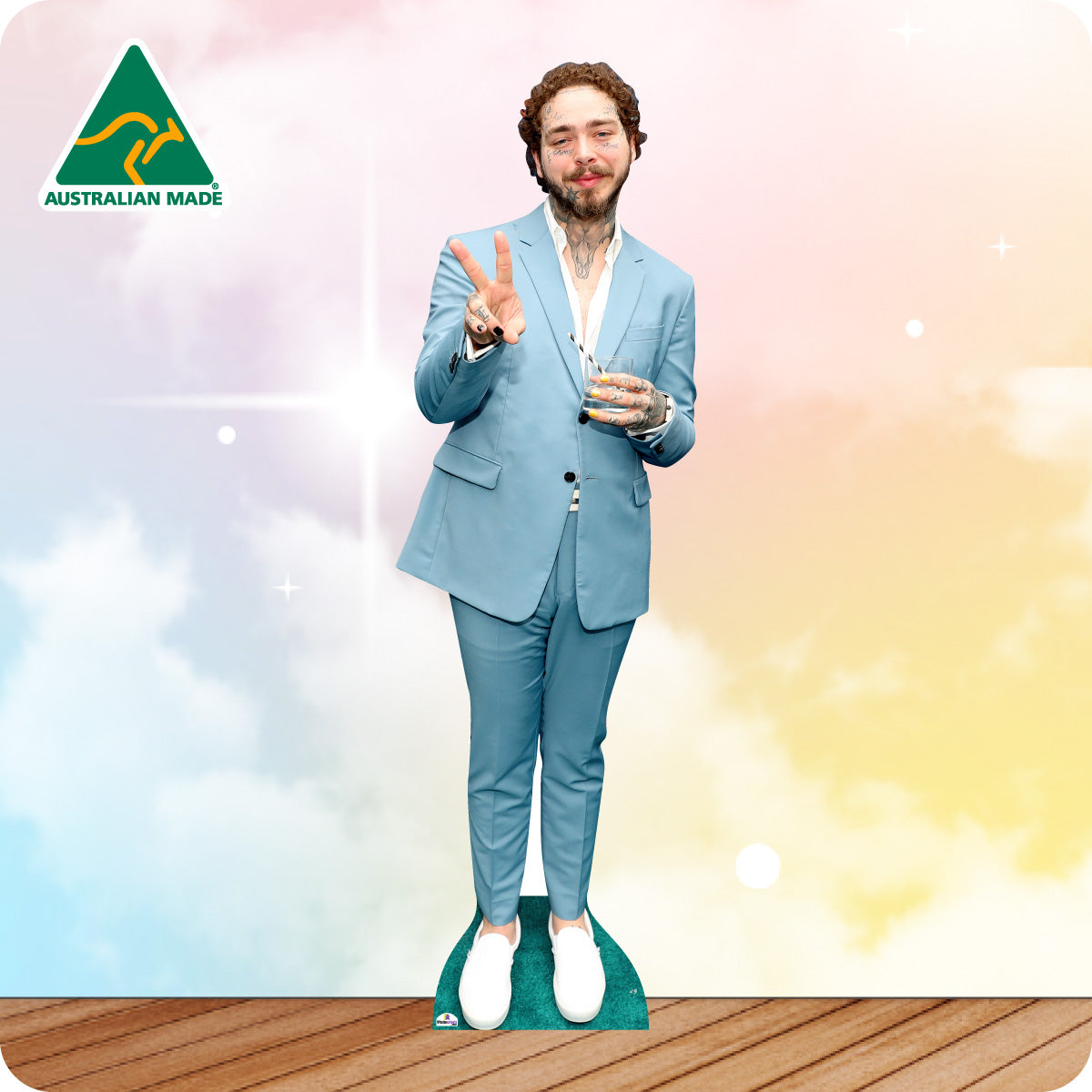 Post malone holding peace sign in a blue suit