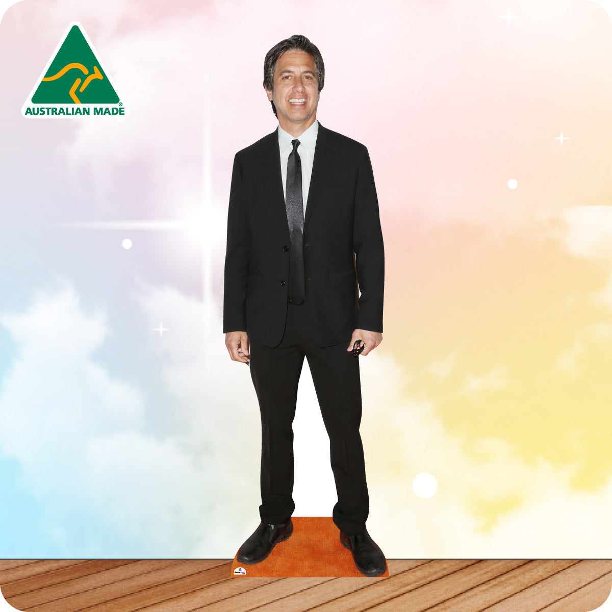 Cardboard standee of a man in a black suit with 'Australian Made' logo on a colorful background.