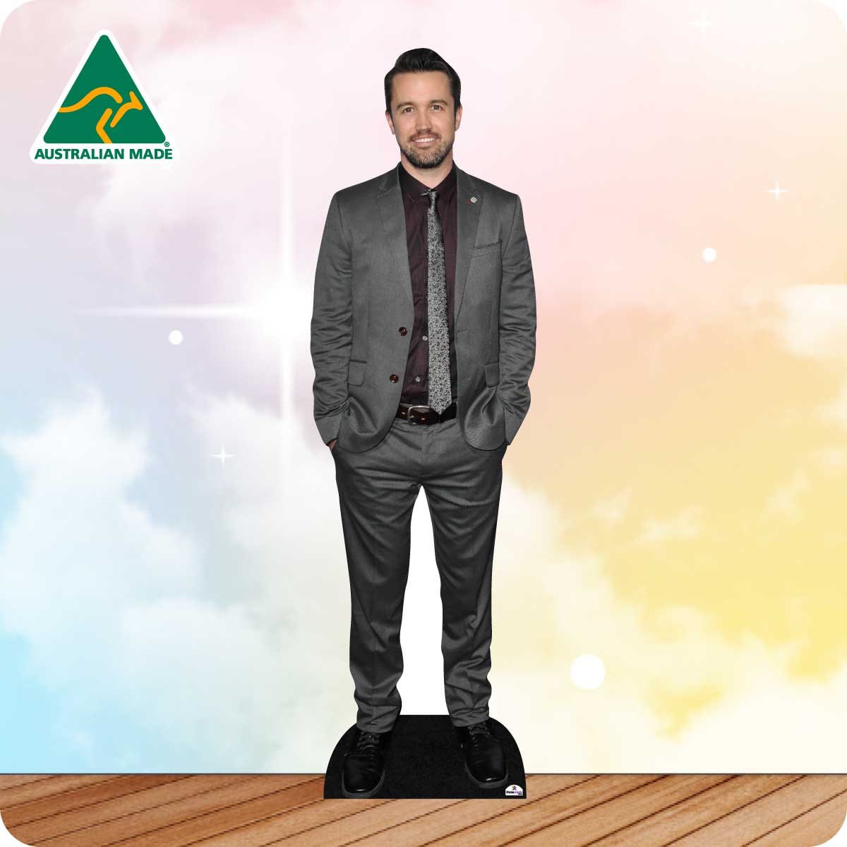 Cardboard cutout of a man in a suit with 'Australian Made' logo on a colorful background