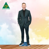 Cardboard cutout of a person in a grey suit with 'Australian Made' logo on a colorful background