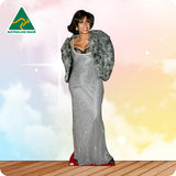 Cardboard standee of a woman in a silver dress with a fur coat against a colorful background, featuring 'Australian Made' logo.