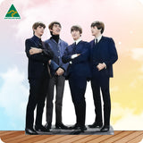 Cardboard cutout of a group in formal attire with 'Australian Made' logo.