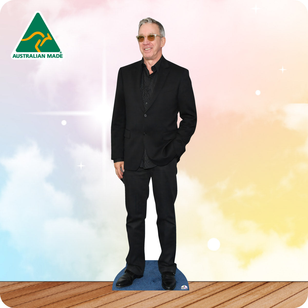 Cardboard standee of a man in a black suit with 'Australian Made' logo on a colorful background.