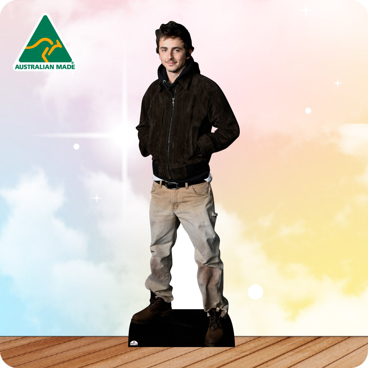 Cardboard standee of a man wearing a black jacket and beige pants on a colorful background with 'Australian Made' logo.