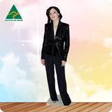 Cardboard standee of a woman in a black suit with 'Australian Made' logo on a colorful background.